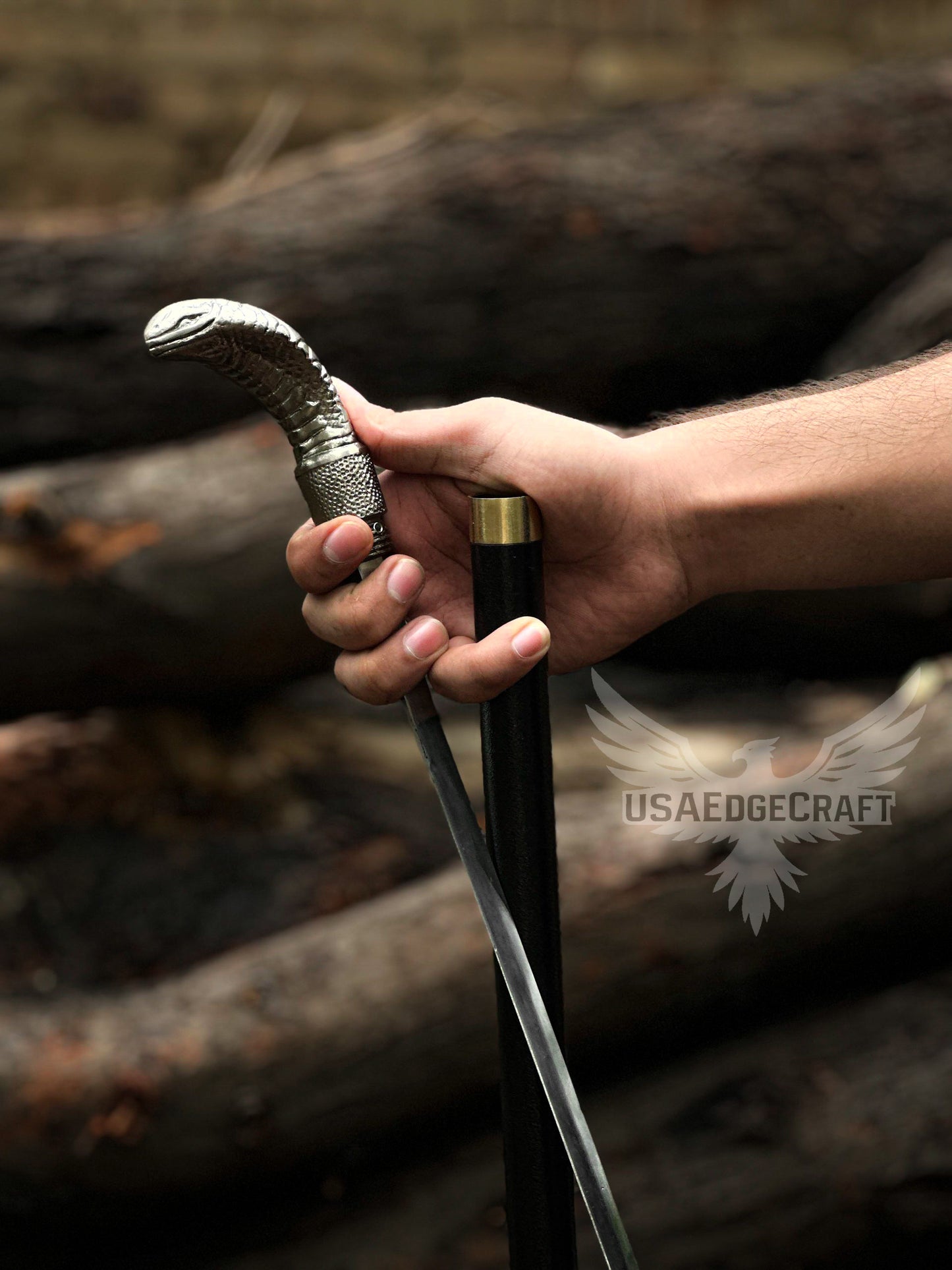 Close-up view of elegant handcrafted snake face walking cane with hidden stainless-steel sword blade, perfect for collectors and enthusiasts.