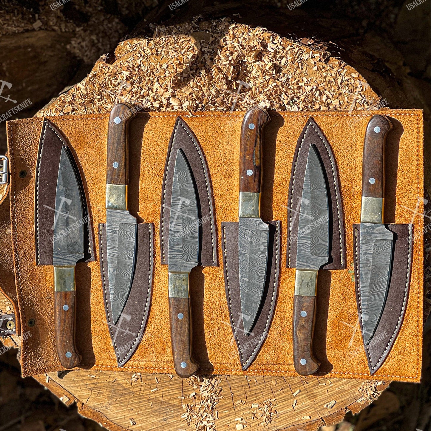 Set of knives in sheaths on a wooden display