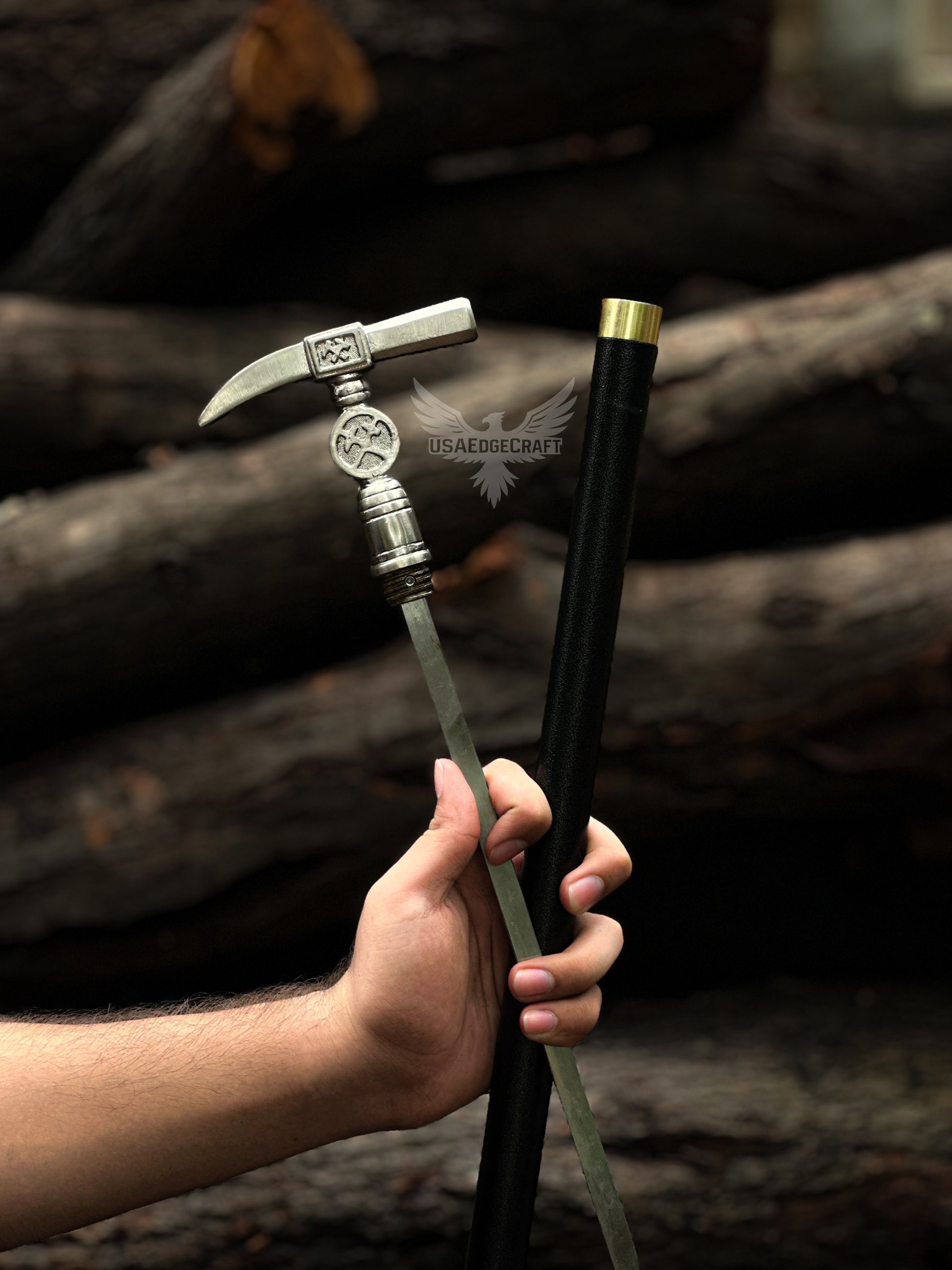 Sharp high carbon steel blade revealed from black metal cane body of custom hammer head walking stick sword for collectors and defense.