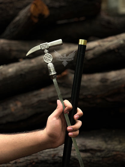 Sharp high carbon steel blade revealed from black metal cane body of custom hammer head walking stick sword for collectors and defense.