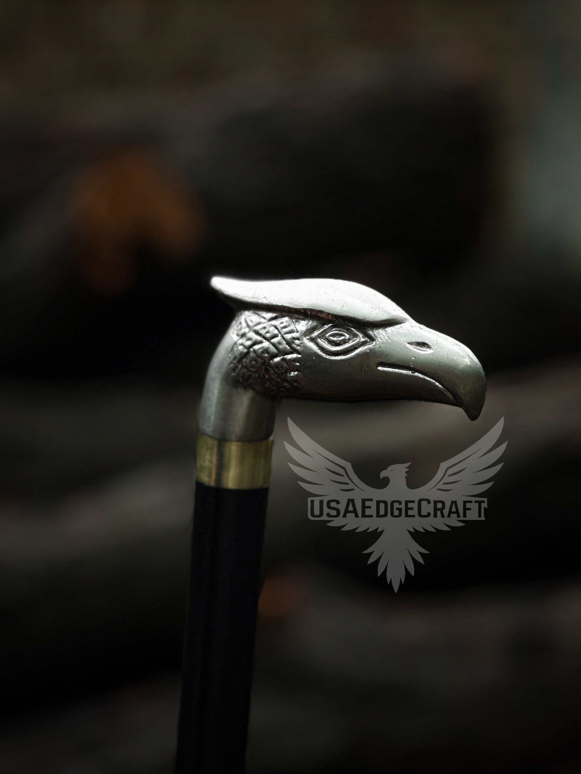 Stylish handcrafted sword cane featuring an eagle head handle and durable black metal cane body.