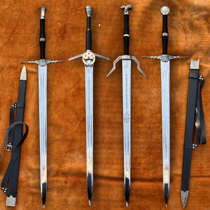 Close-up of Witcher sword blades showing detailed engravings and flawless mirror finish craftsmanship.