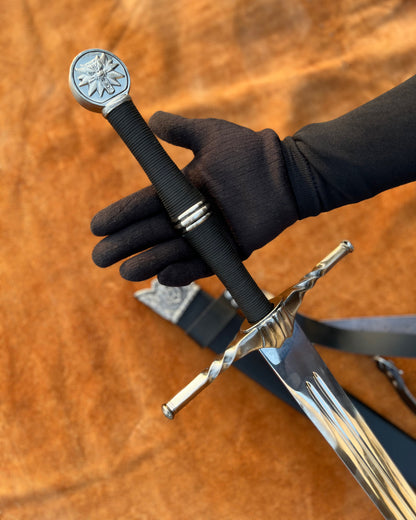 The Witcher Monster Slayer Silver Sword replica, handcrafted collectible with polished blade and fantasy-themed guard